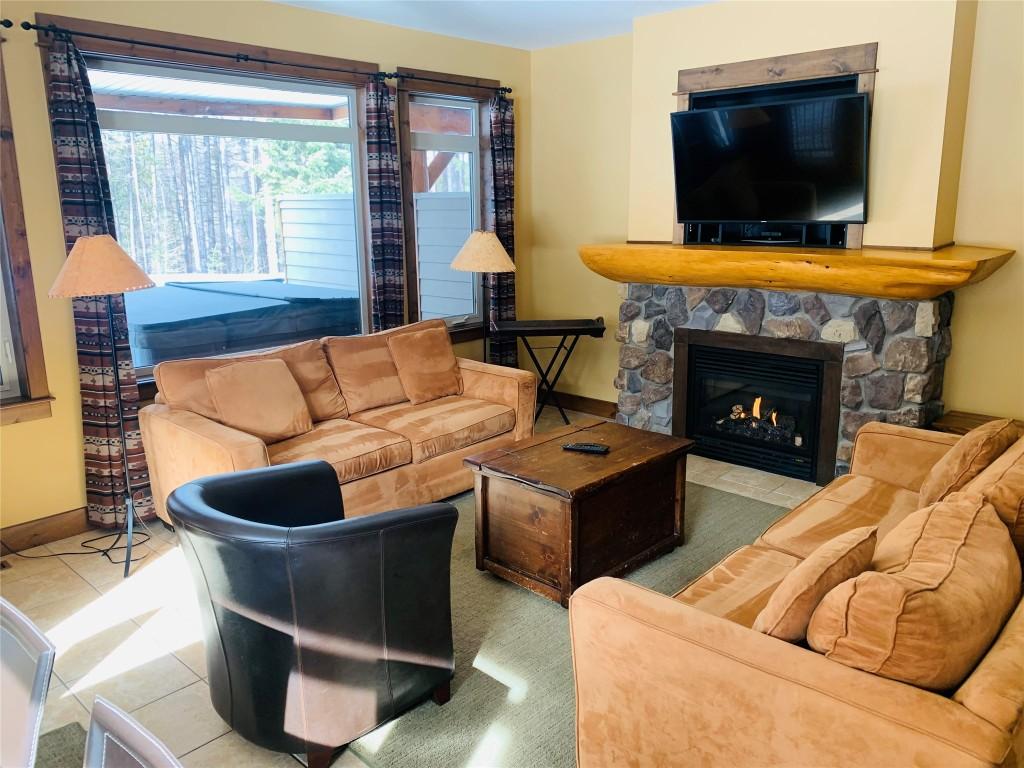 04A-1351 Gerry Sorensen Way, Kimberley, BC - Indoor Photo Showing Living Room With Fireplace