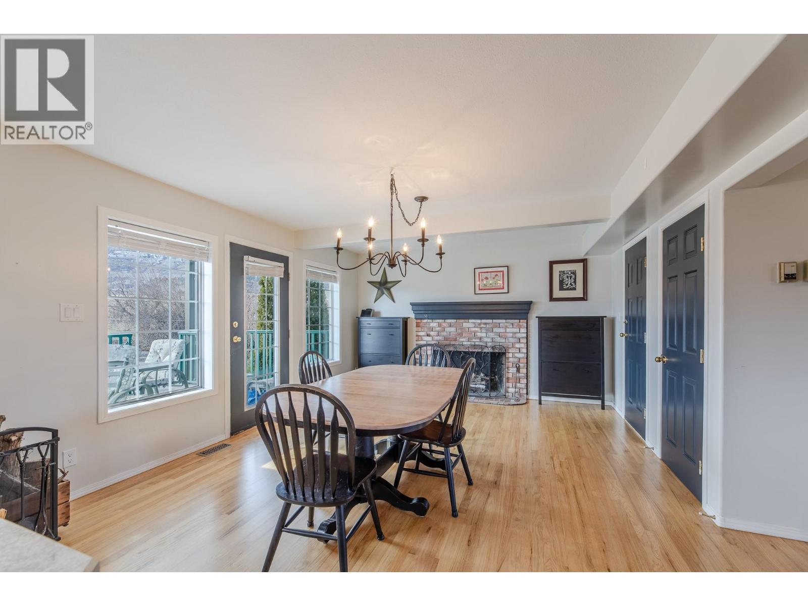 445 Road 5, Oliver, BC - Indoor Photo Showing Dining Room With Fireplace