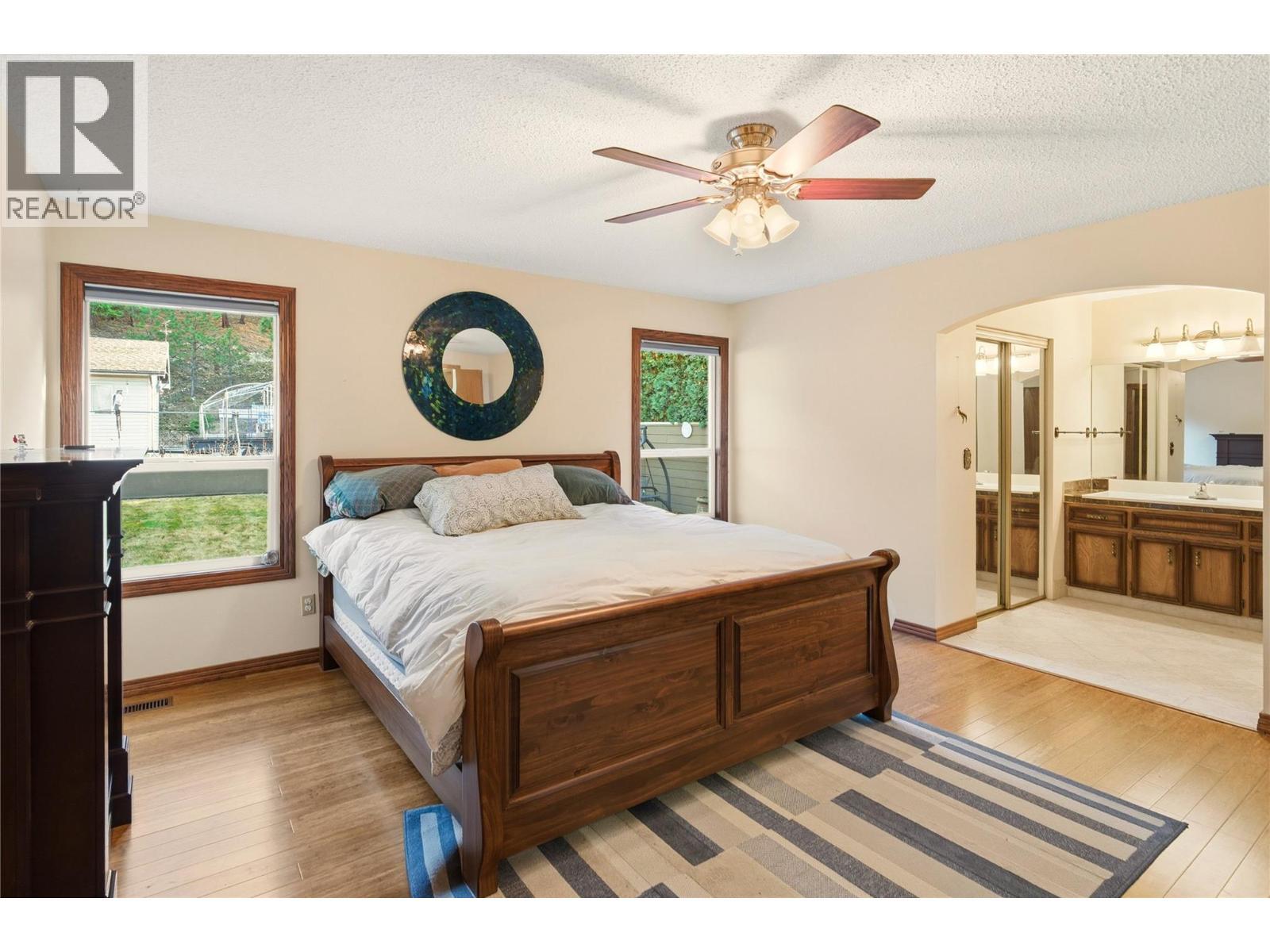 Primary Bedroom - 1099 Dehart Road, Kelowna, BC - Indoor Photo Showing Bedroom