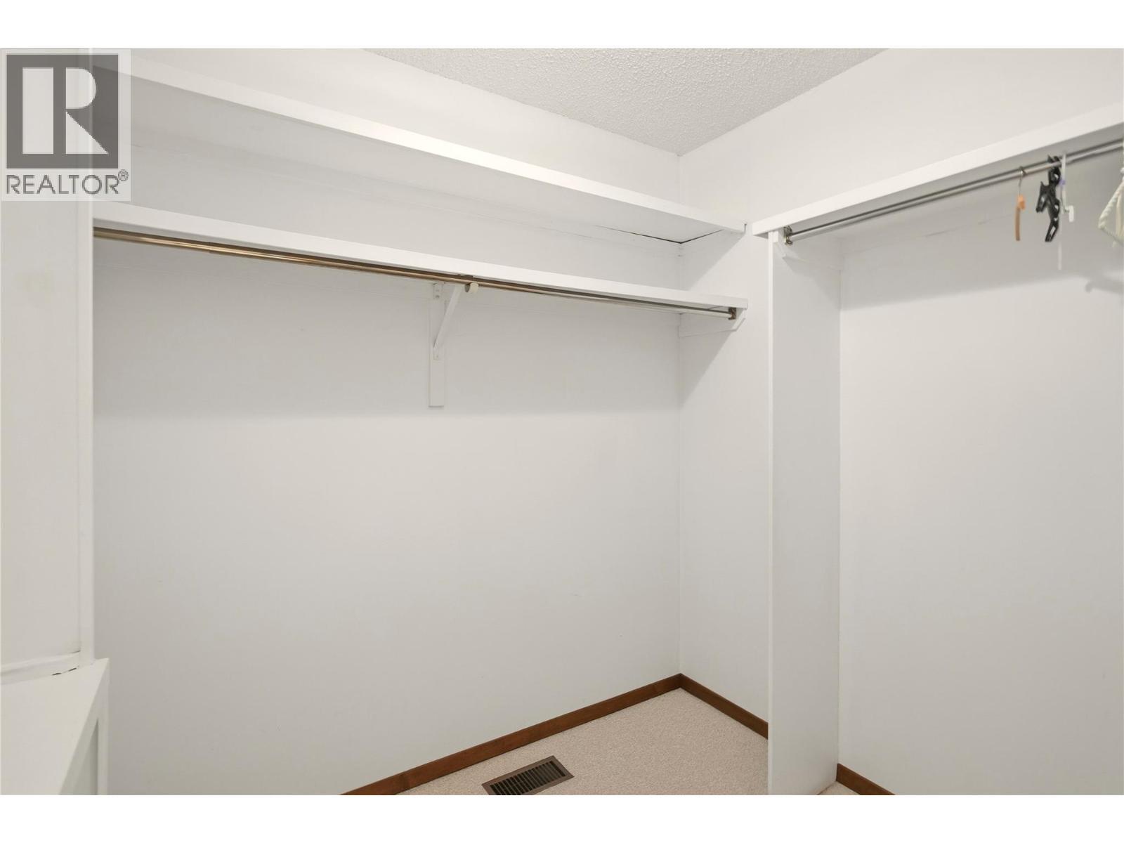 Primary closet - 1099 Dehart Road, Kelowna, BC - Indoor With Storage