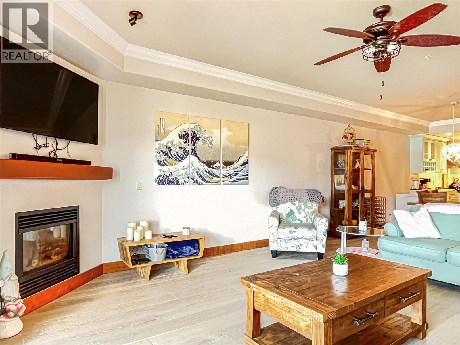 2418 Lakeshore Drive Unit# 302, Osoyoos, BC - Indoor Photo Showing Living Room With Fireplace