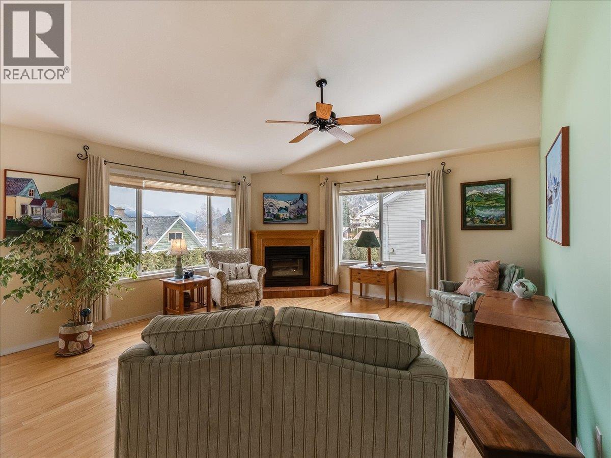 Main Floor Living Room - 702 Munro Street, Nelson, BC - Indoor Photo Showing Living Room With Fireplace