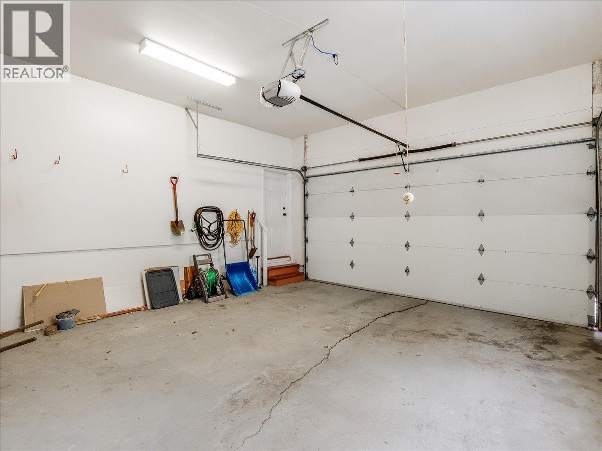 Double Car Garage - 702 Munro Street, Nelson, BC - Indoor Photo Showing Garage