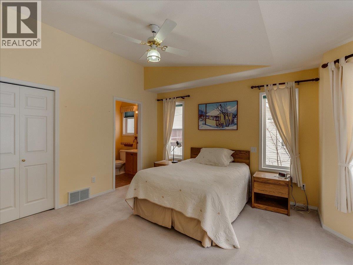 Primary Bedroom - 702 Munro Street, Nelson, BC - Indoor Photo Showing Bedroom