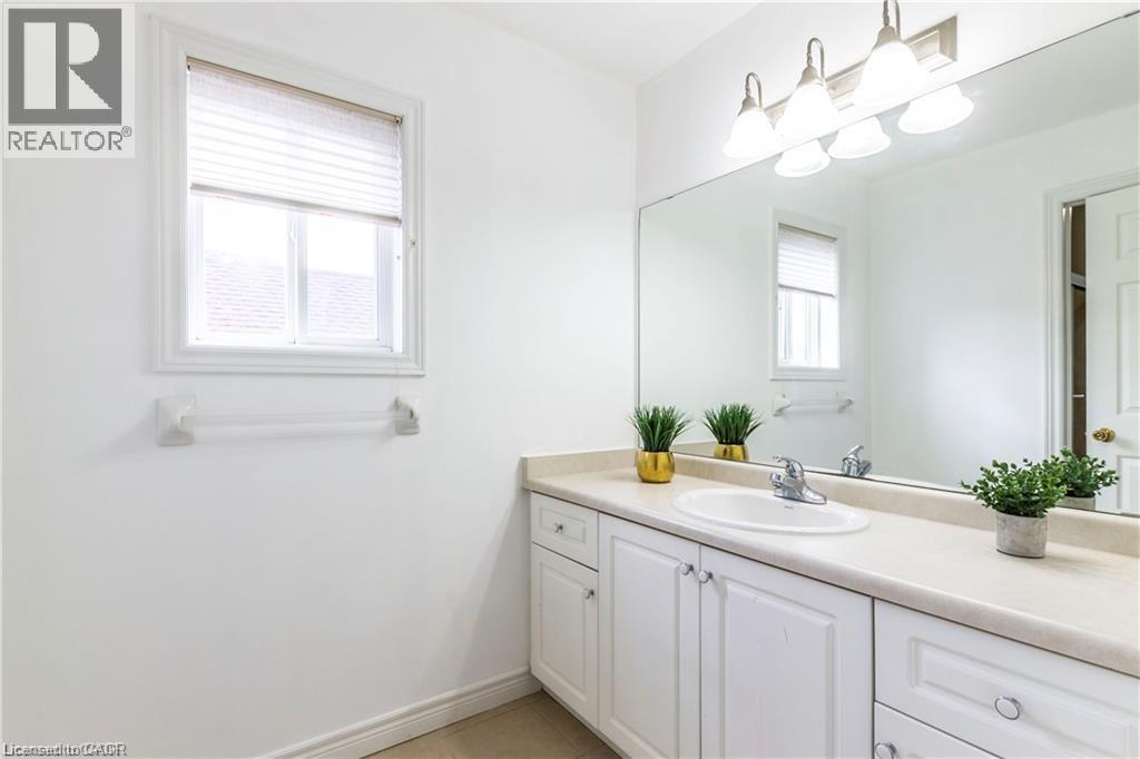 Bathroom featuring vanity and light tile patterned flooring - 252 Thorner Drive Unit# Upper, Hamilton, ON - Indoor Photo Showing Bathroom
