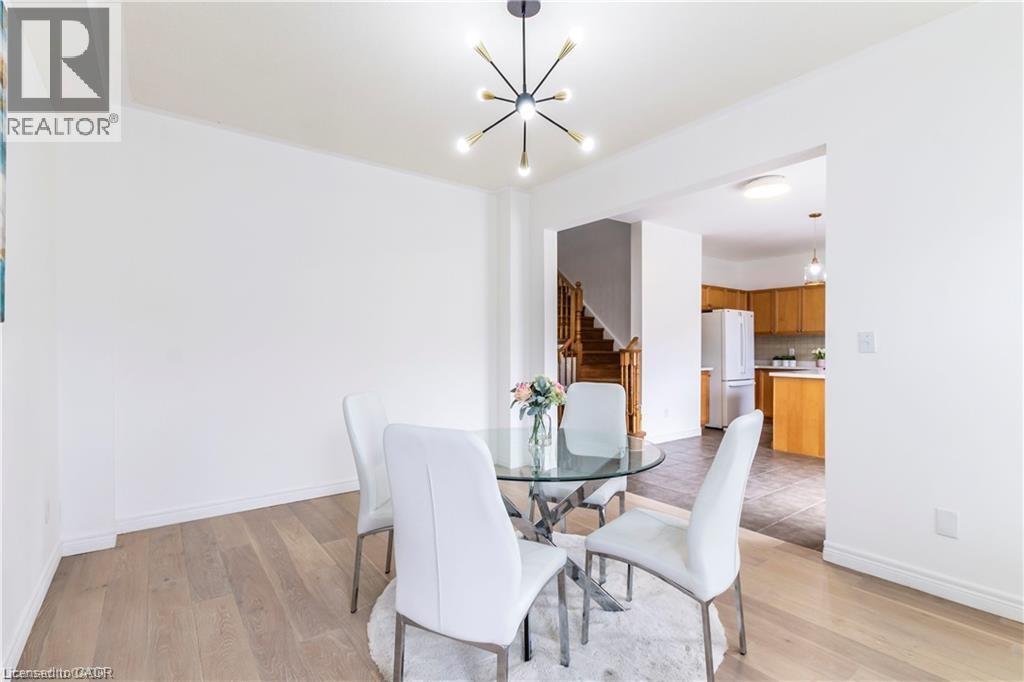 Dining area featuring hanging lights and light wood-type flooring - 252 Thorner Drive Unit# Upper, Hamilton, ON - Indoor Photo Showing Dining Room