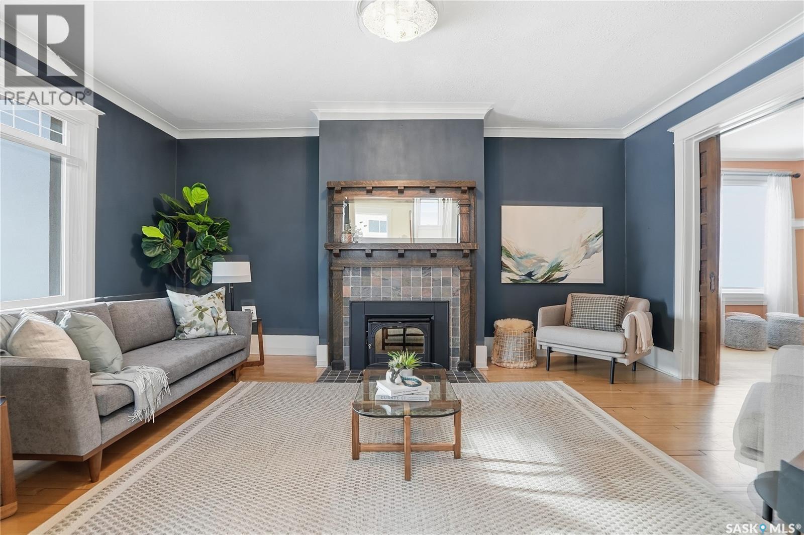 702 Queen Street, Saskatoon, SK - Indoor Photo Showing Living Room With Fireplace