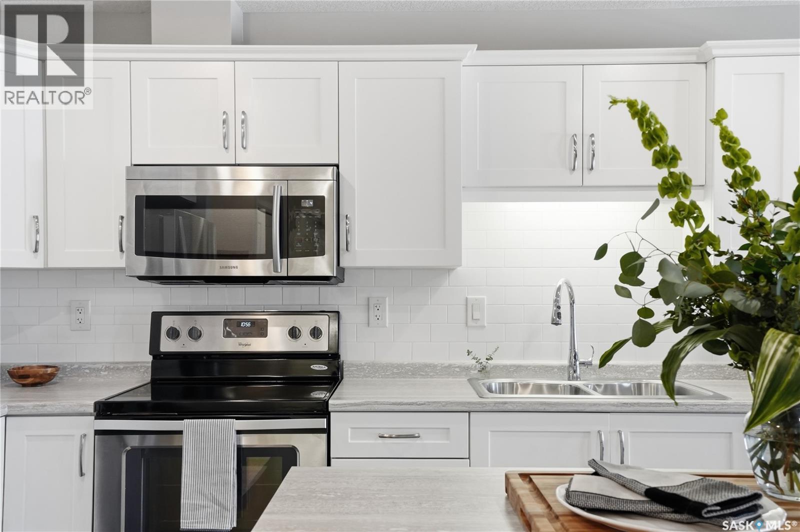 2105 104 Willis Crescent, Saskatoon, SK - Indoor Photo Showing Kitchen With Stainless Steel Kitchen With Double Sink