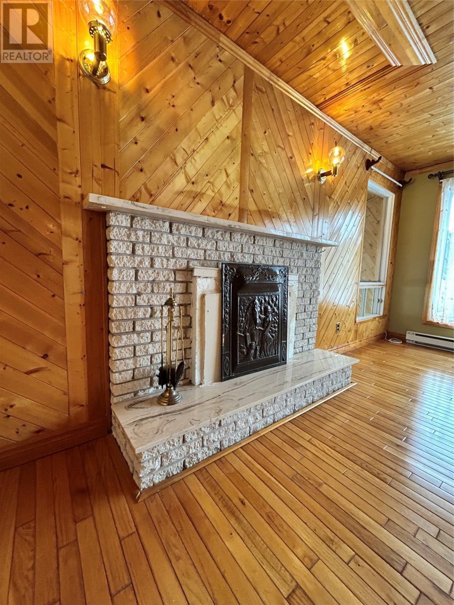 8 Cod Seine Road, Mobile, NL - Indoor With Fireplace