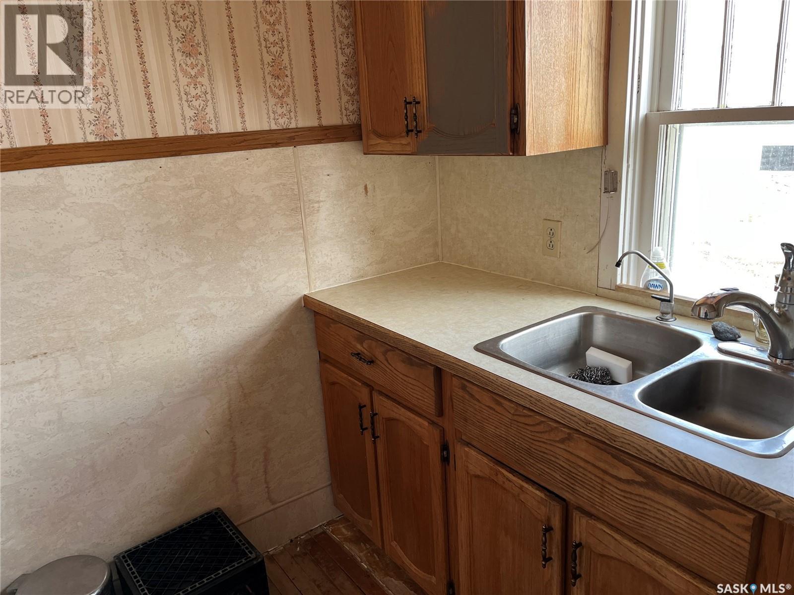 133 2Nd Street E, Lafleche, SK - Indoor Photo Showing Kitchen With Double Sink