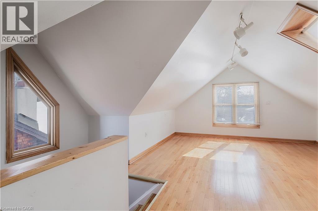 Bonus room featuring vaulted ceiling and light wood-type flooring - 84 South Oval, Hamilton, ON - Indoor Photo Showing Other Room