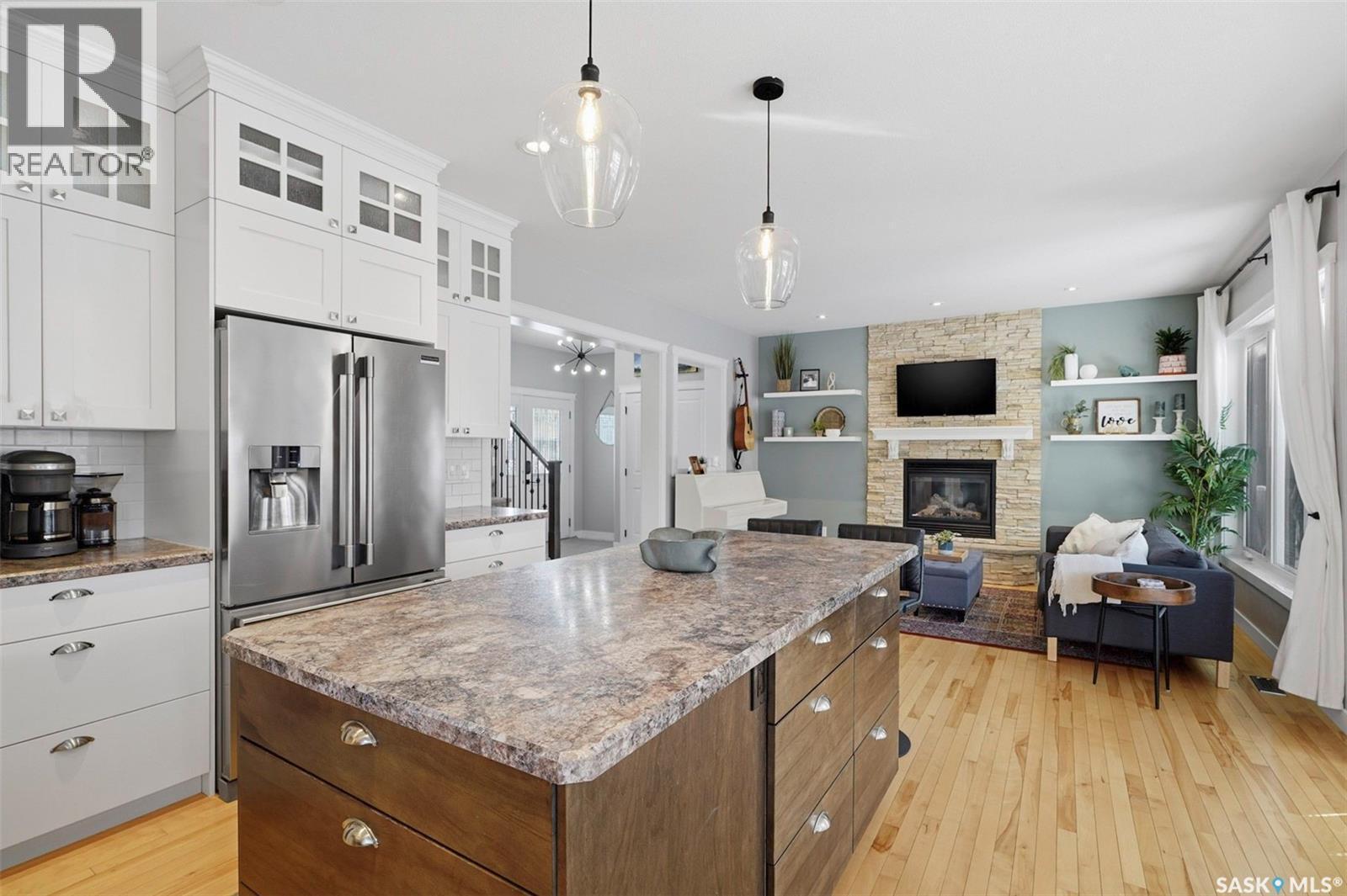 516 Atton Lane, Saskatoon, SK - Indoor Photo Showing Kitchen With Fireplace