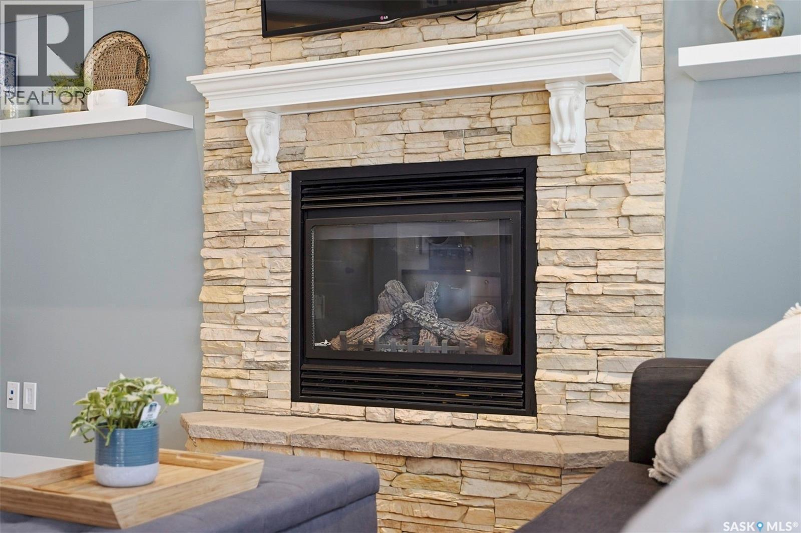 516 Atton Lane, Saskatoon, SK - Indoor Photo Showing Living Room With Fireplace