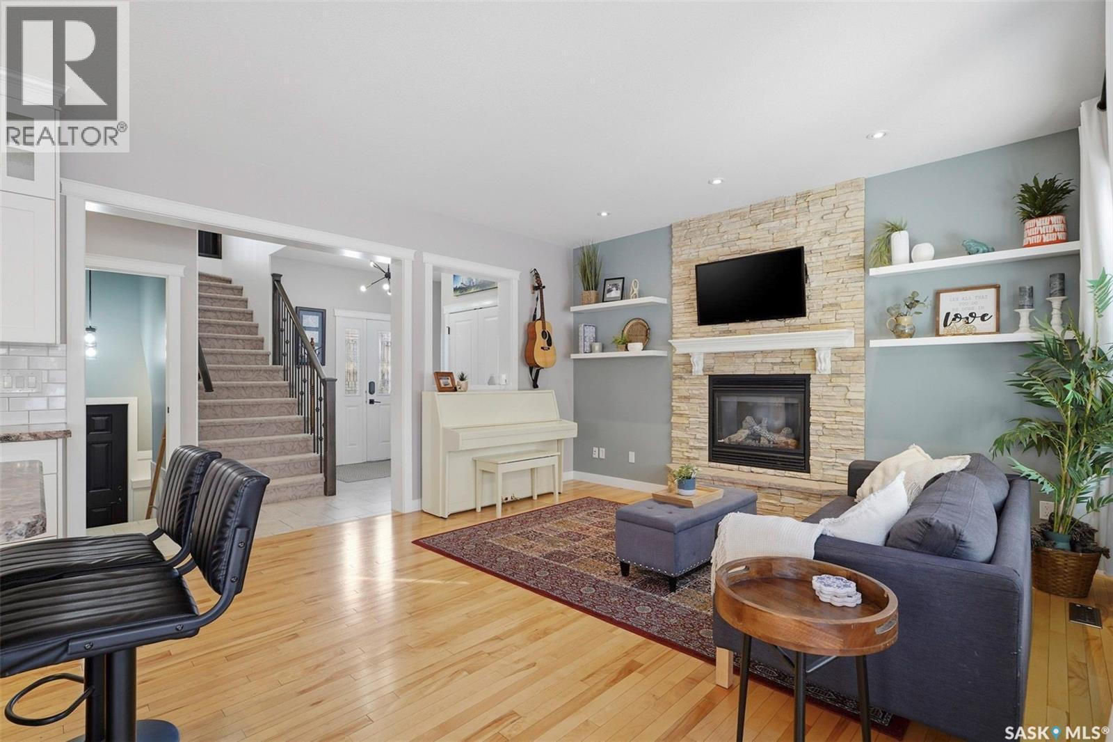 516 Atton Lane, Saskatoon, SK - Indoor Photo Showing Living Room With Fireplace