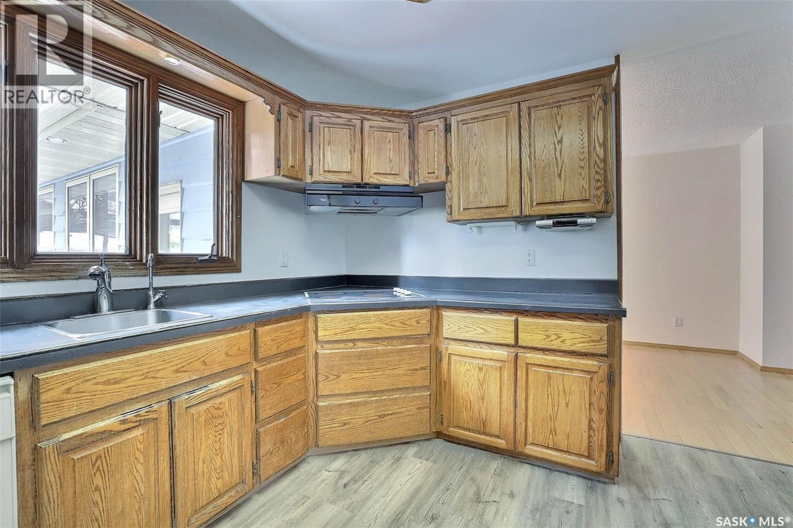 14 Deergrove Crescent, Regina, SK - Indoor Photo Showing Kitchen With Double Sink