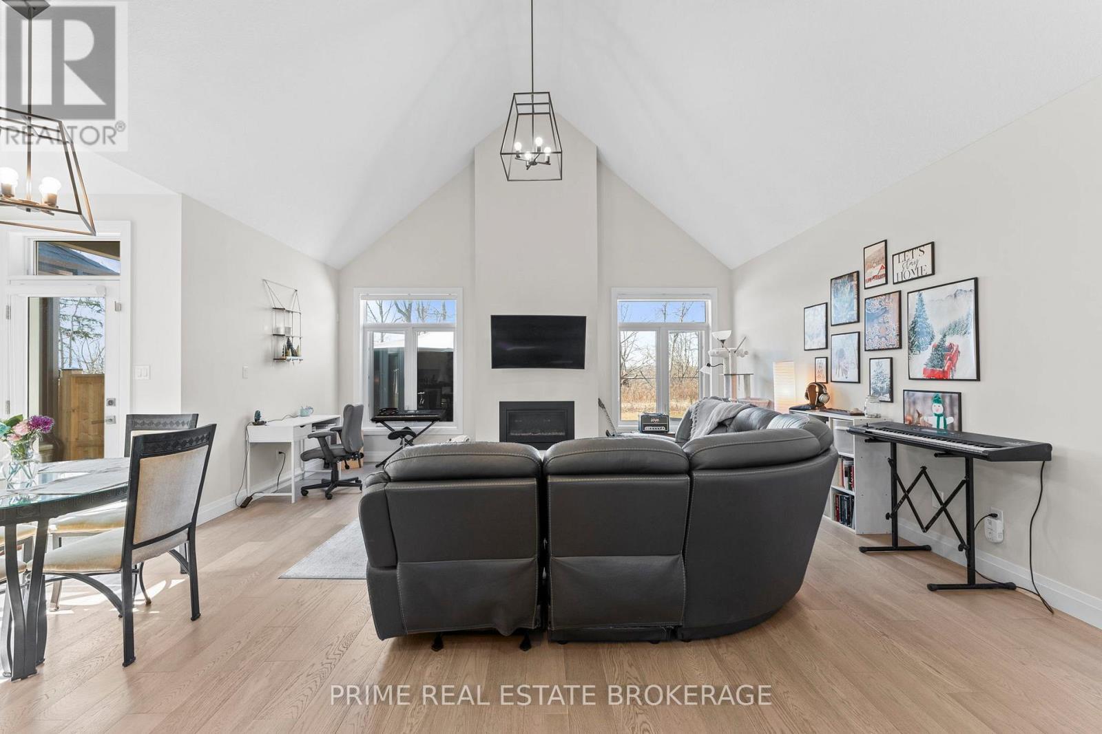 15 Compass Trail, Central Elgin, ON - Indoor Photo Showing Living Room With Fireplace