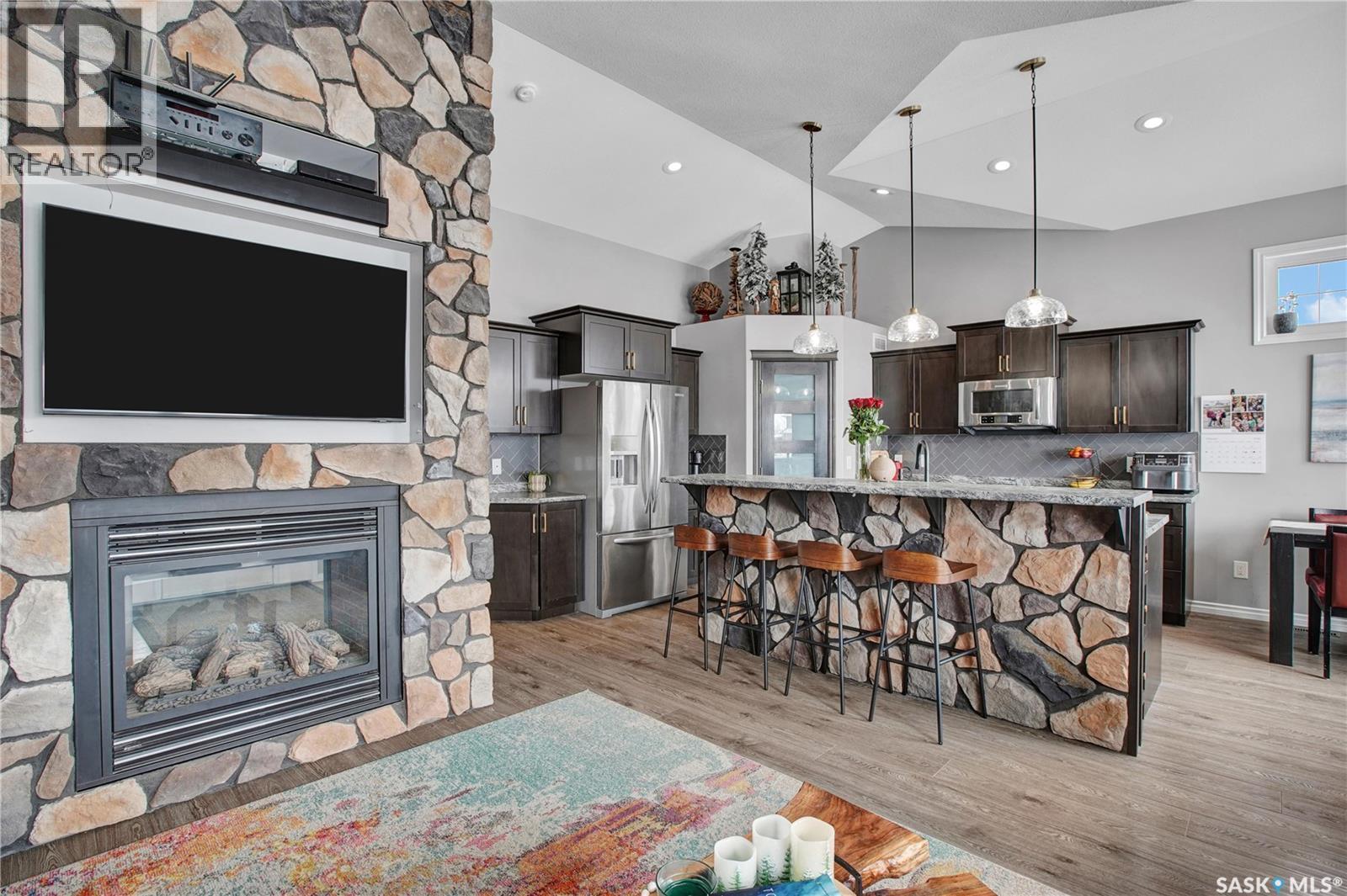 426 Lyle Crescent, Warman, SK - Indoor Photo Showing Other Room With Fireplace