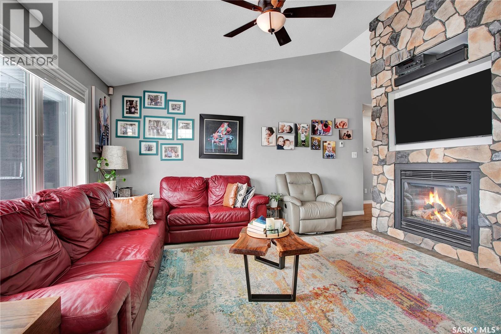 426 Lyle Crescent, Warman, SK - Indoor Photo Showing Living Room With Fireplace