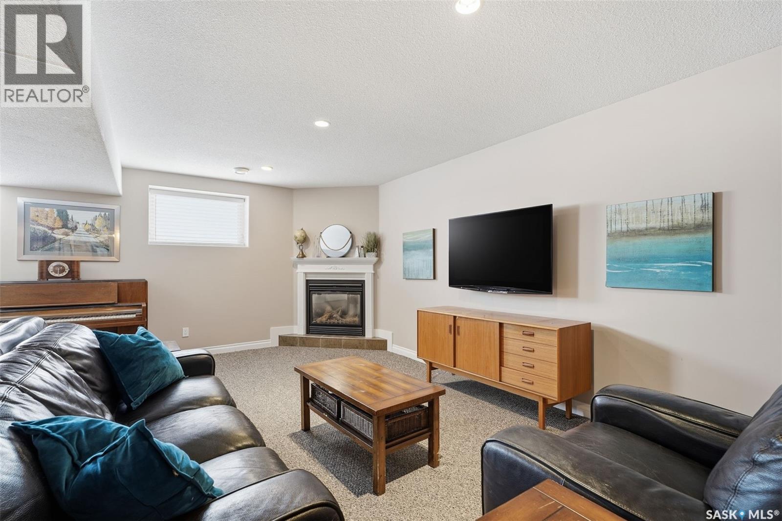 12 Longpre Crescent, Prince Albert, SK - Indoor Photo Showing Living Room With Fireplace