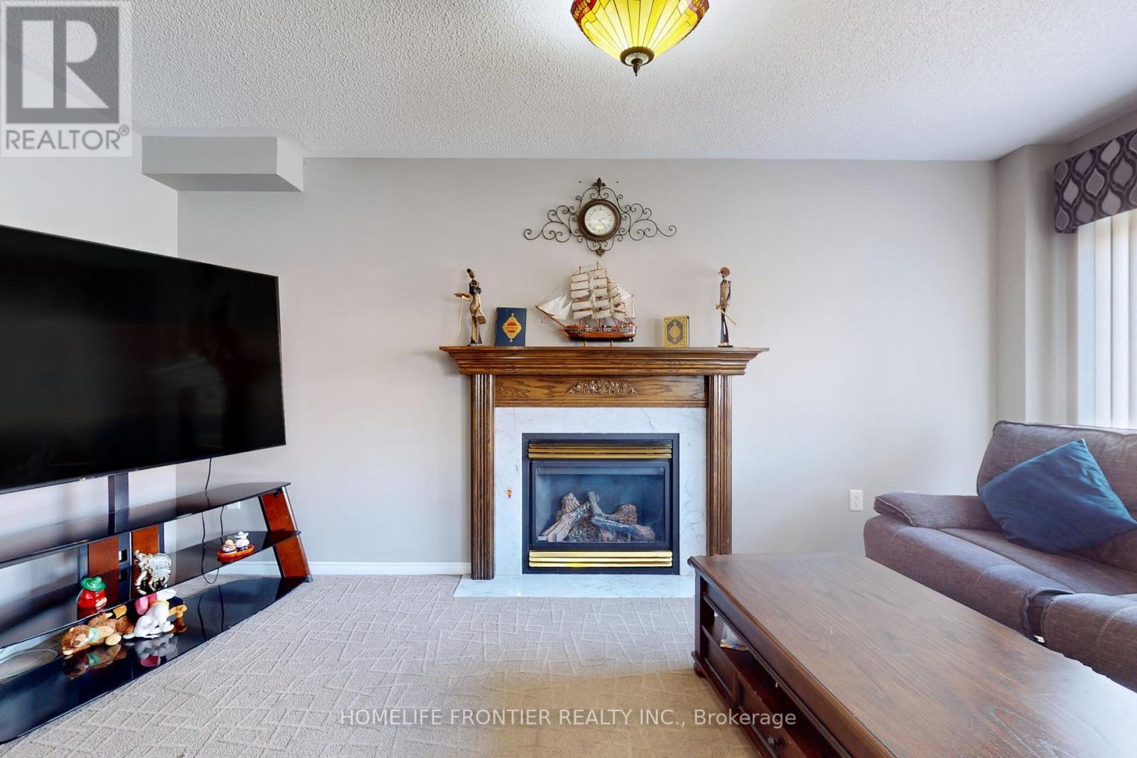 48 Patrick Drive S, Barrie, ON - Indoor Photo Showing Living Room With Fireplace