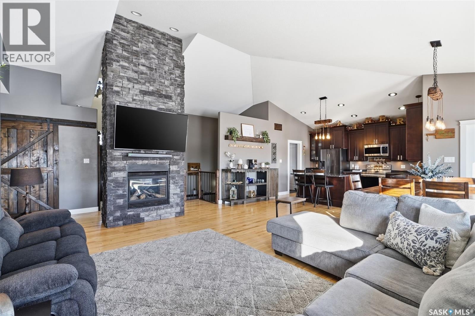 307 Brookside Drive, Warman, SK - Indoor Photo Showing Living Room With Fireplace