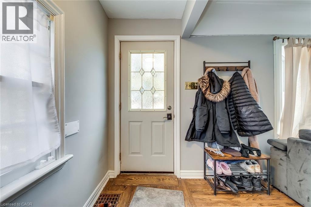Mudroom featuring parquet flooring and baseboards - 142 Ewen Road, Hamilton, ON - Indoor