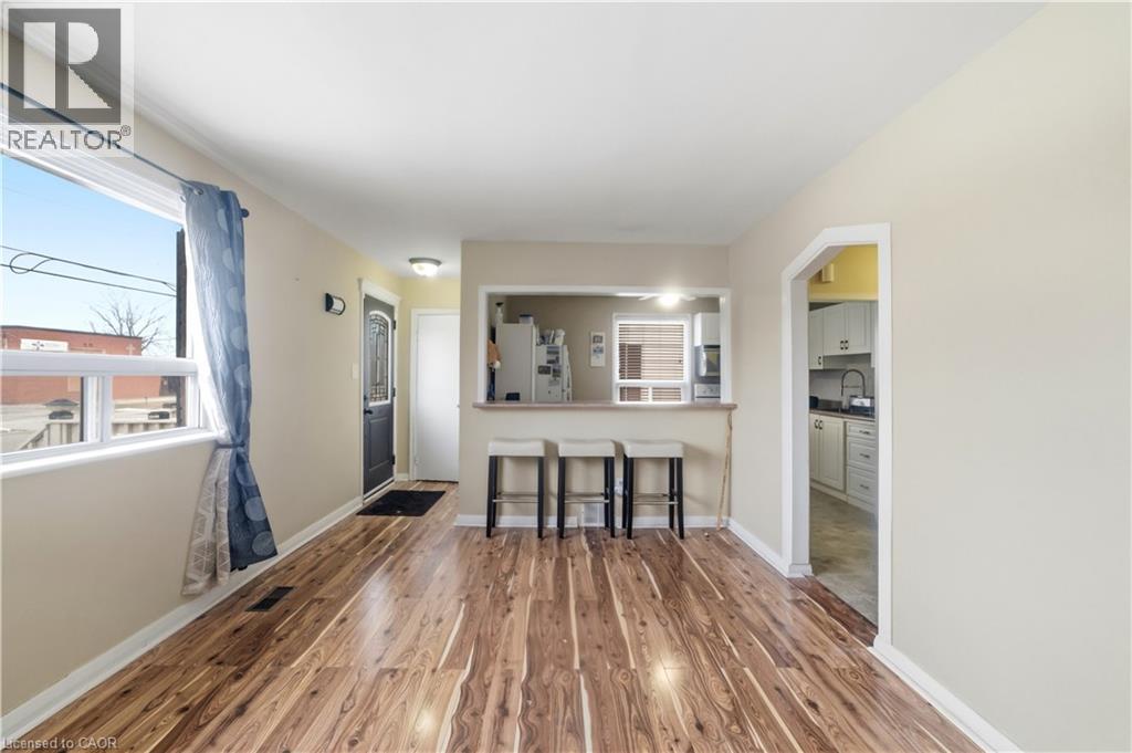 Unfurnished living room with dark wood finished floors and baseboards - 776 Britannia Avenue, Hamilton, ON - Indoor Photo Showing Other Room