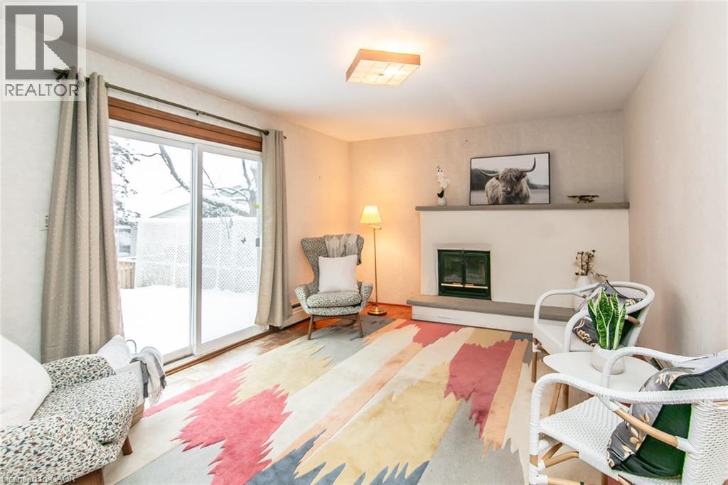 198 Ashcroft Place, Waterloo, ON - Indoor Photo Showing Living Room With Fireplace