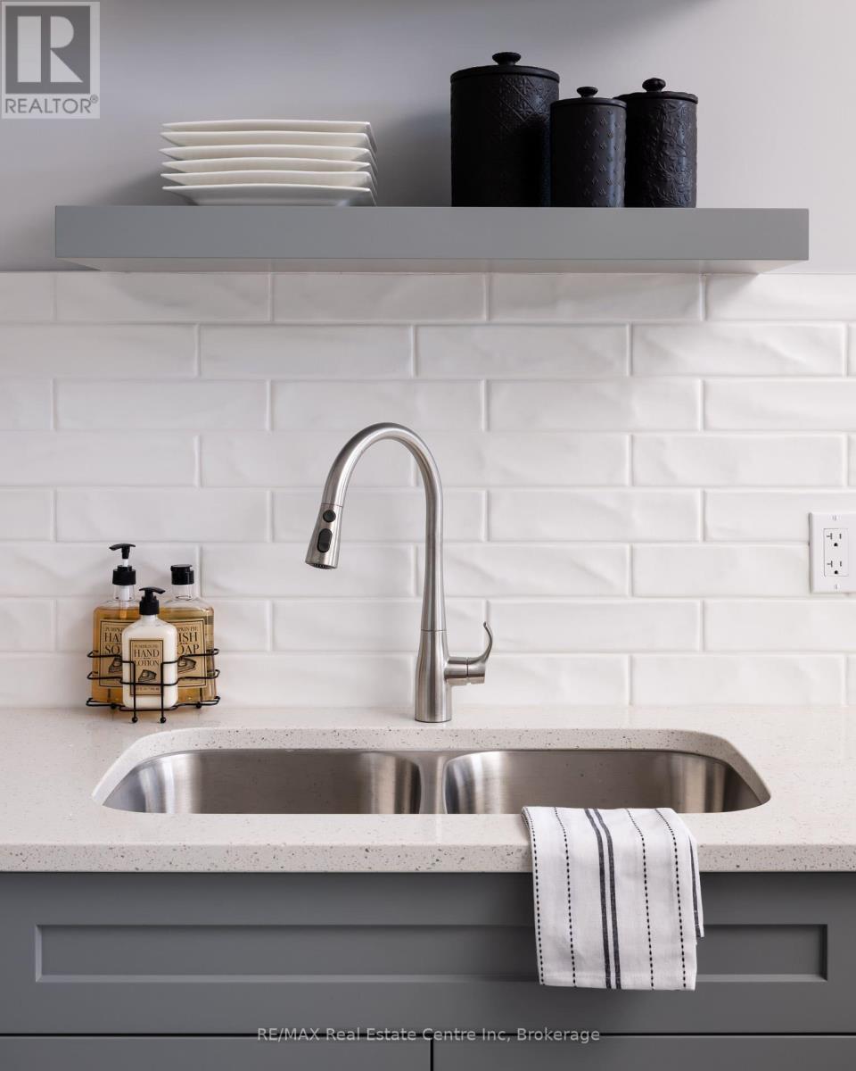 Photo is representation of Builders work - 194 Bridge Crescent, Minto, ON - Indoor Photo Showing Kitchen With Double Sink With Upgraded Kitchen