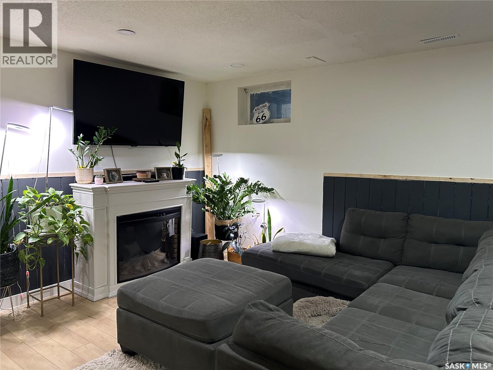 816 8Th Avenue, Rosthern, SK - Indoor Photo Showing Living Room With Fireplace