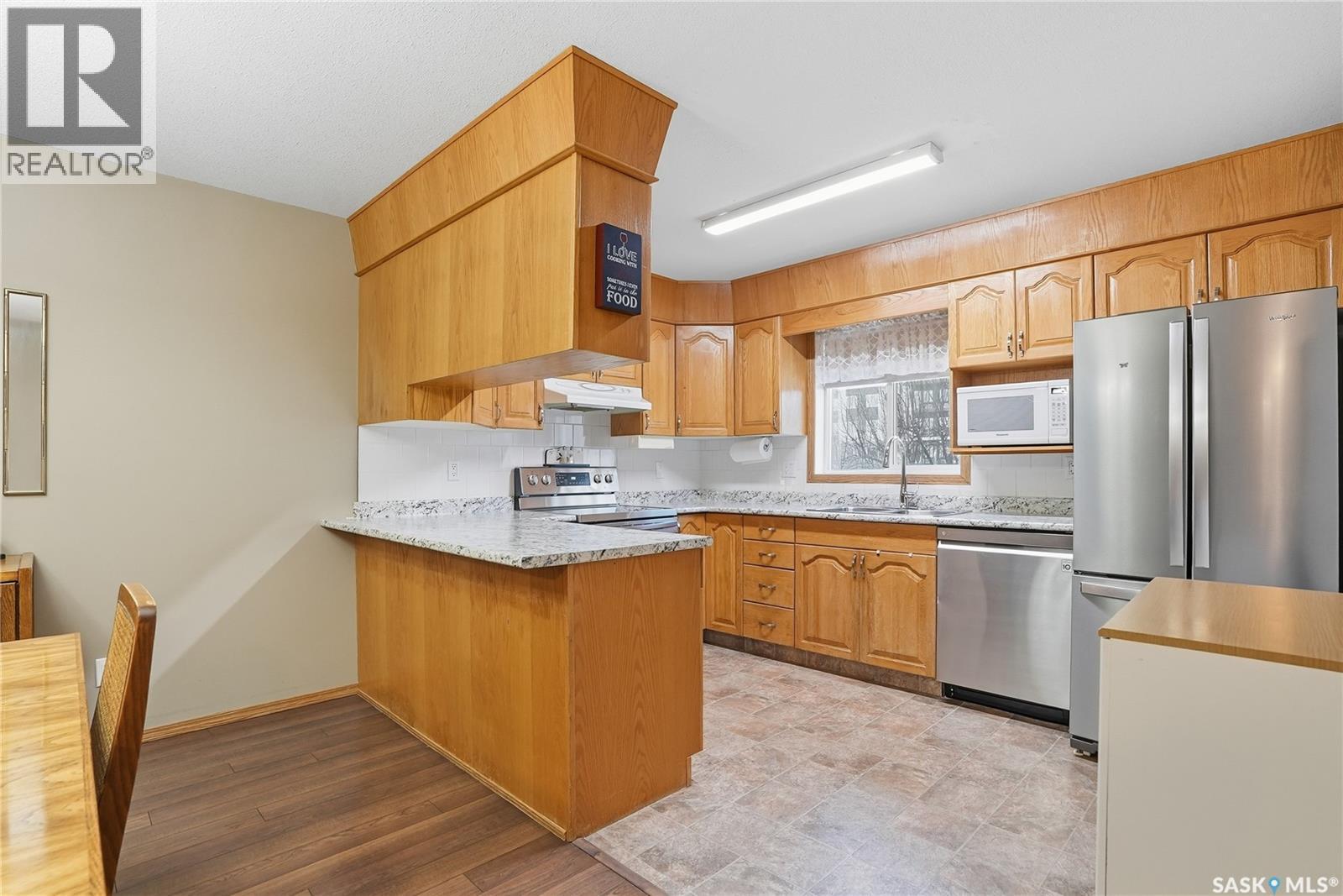 111 103 Keevil Crescent, Saskatoon, SK - Indoor Photo Showing Kitchen With Stainless Steel Kitchen With Double Sink