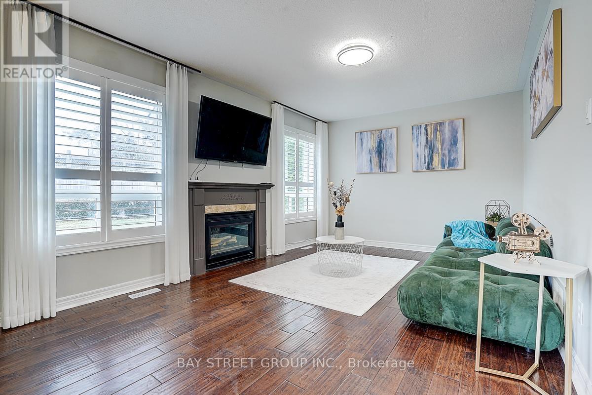 52 Whitewater Street, Whitby, ON - Indoor Photo Showing Living Room With Fireplace