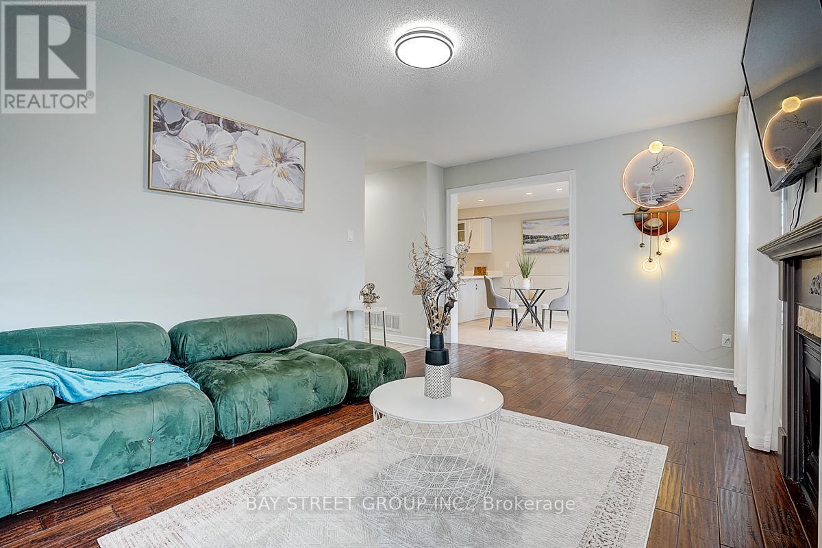 52 Whitewater Street, Whitby, ON - Indoor Photo Showing Living Room With Fireplace