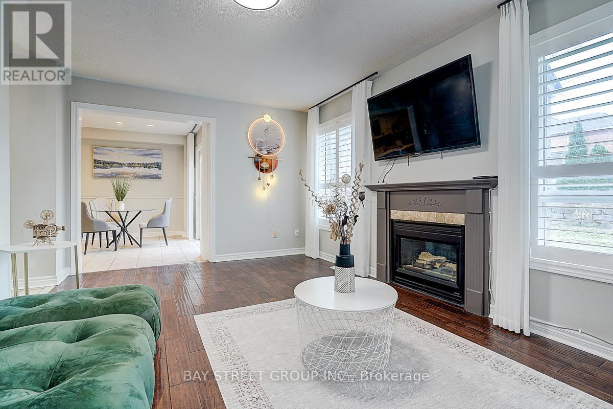 52 Whitewater Street, Whitby, ON - Indoor Photo Showing Living Room With Fireplace