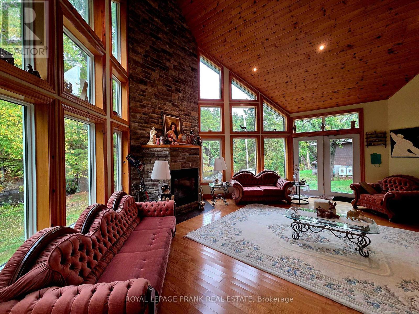 8847 Highway 28, North Kawartha, ON - Indoor Photo Showing Living Room With Fireplace