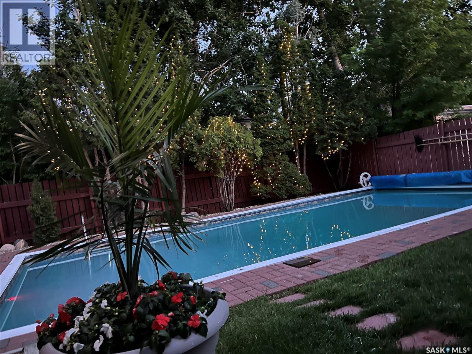219 Sunset Drive, Regina, SK - Outdoor With In Ground Pool