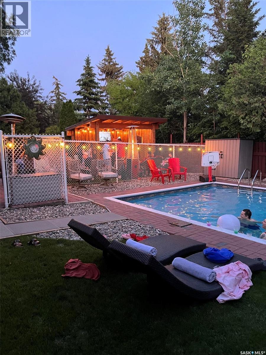 219 Sunset Drive, Regina, SK - Outdoor With In Ground Pool With Deck Patio Veranda