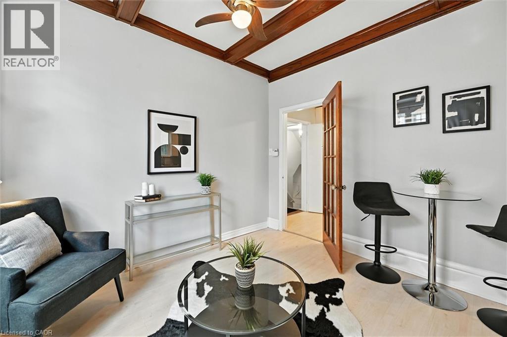Living area with ceiling fan, wood finished floors, and beamed ceiling - 1047 Main Street E, Hamilton, ON - Indoor Photo Showing Dining Room