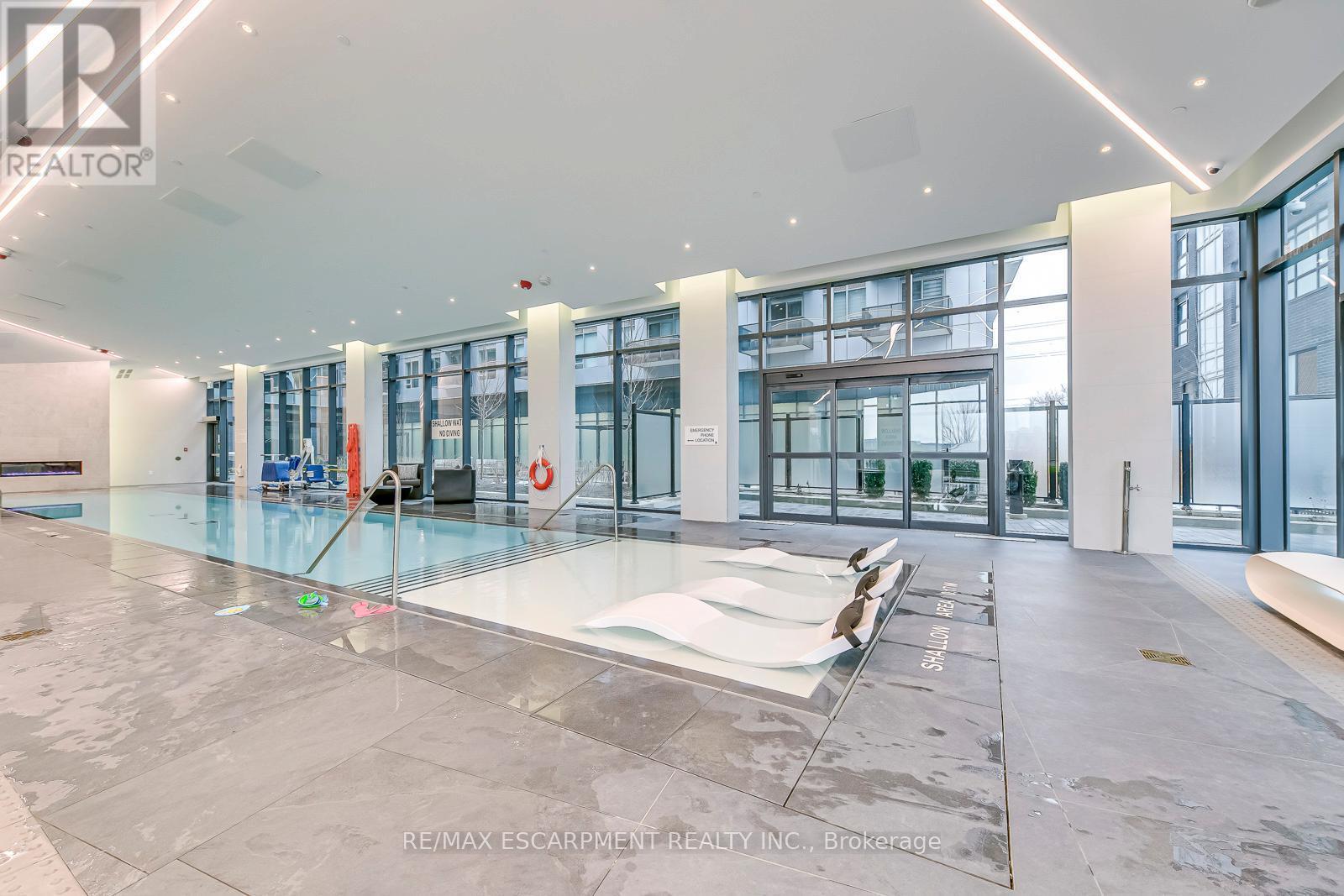 112 - 2450 Old Bronte Road, Oakville, ON - Indoor Photo Showing Other Room With In Ground Pool