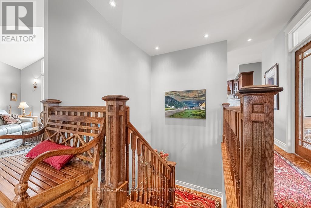 Open Oak Stairs leading into Lower Level - 6980 Mansfield Road, Ottawa, ON - Indoor Photo Showing Other Room