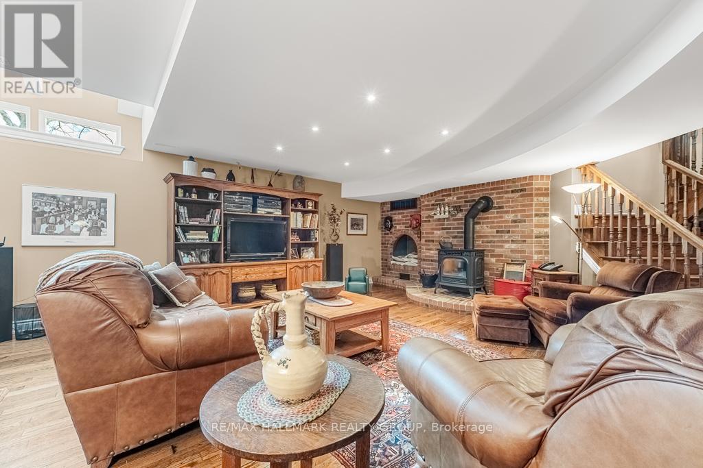 Basement 9' Ceilings and Extra Lighting - 6980 Mansfield Road, Ottawa, ON - Indoor Photo Showing Living Room With Fireplace