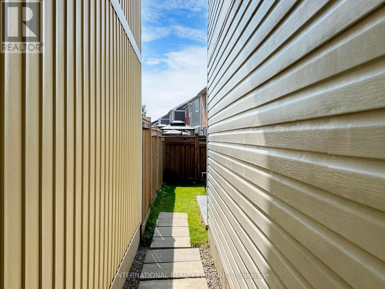 Walk from garage to backyard - 110 Swenson Street, New Tecumseth, ON -