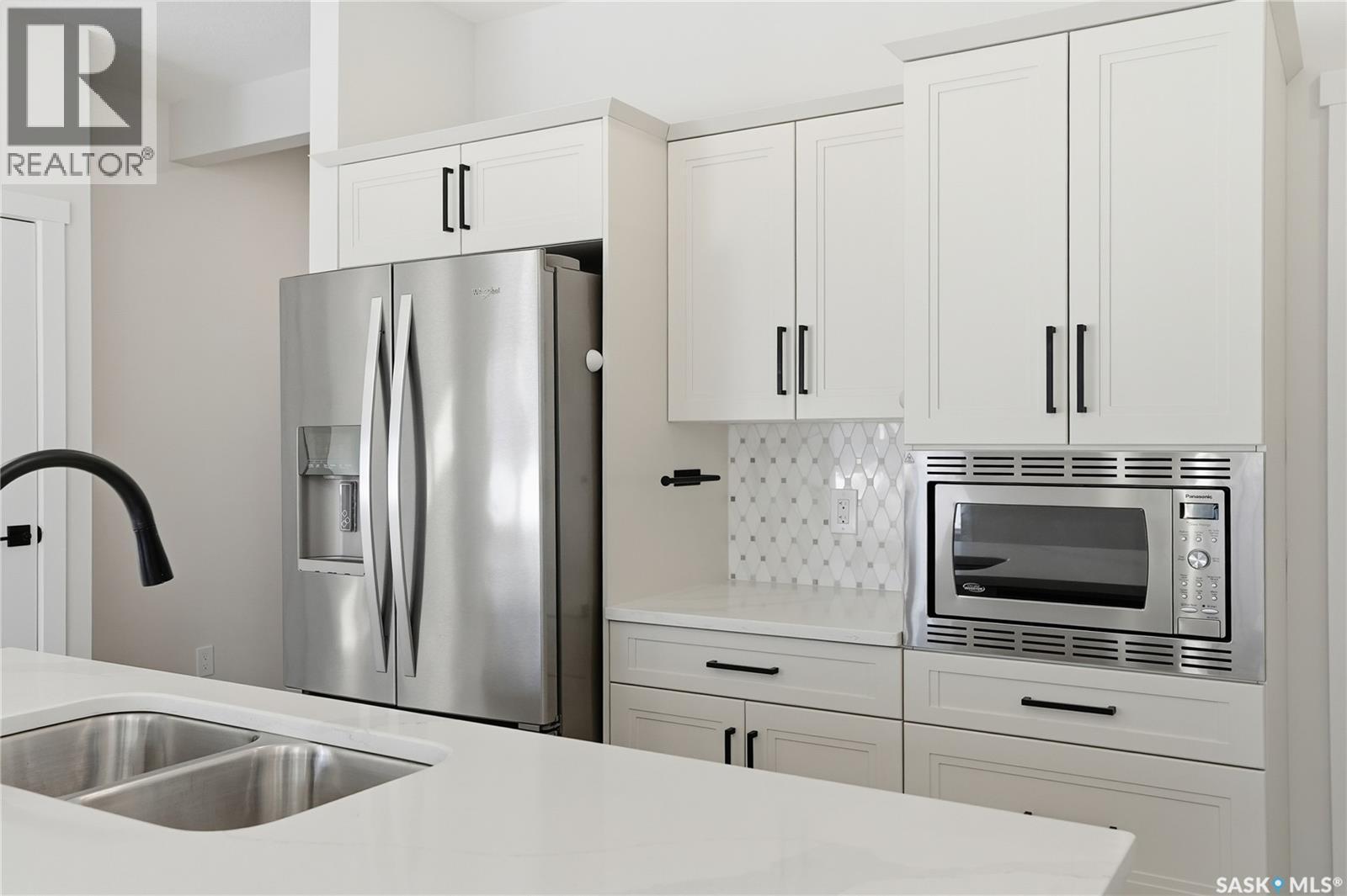 134 Chelsom Bend, Saskatoon, SK - Indoor Photo Showing Kitchen With Double Sink