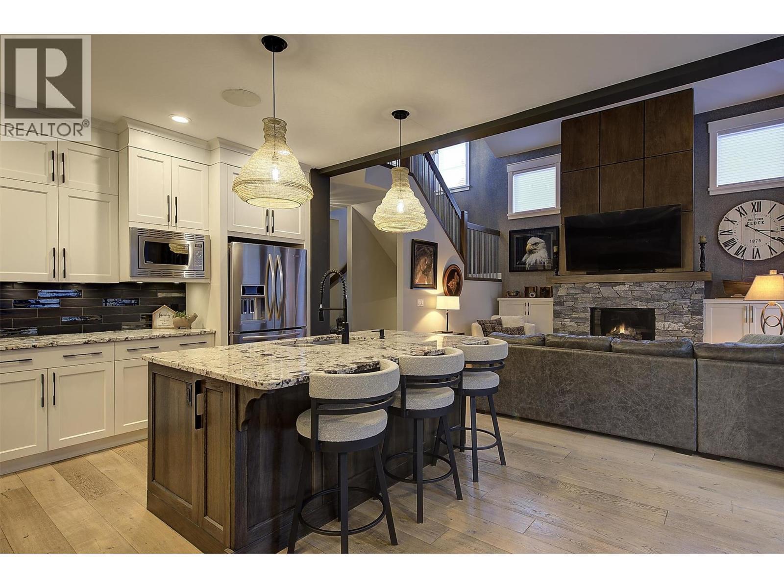 5499 Mountainside Drive, Kelowna, BC - Indoor Photo Showing Kitchen With Fireplace With Upgraded Kitchen