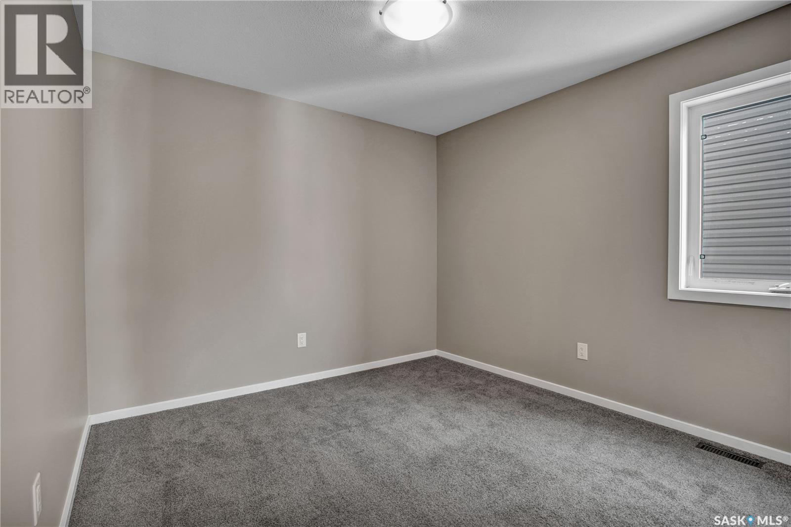 104 Reddekopp Crescent, Warman, SK - Indoor Photo Showing Other Room