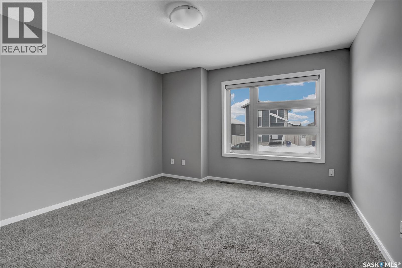 104 Reddekopp Crescent, Warman, SK - Indoor Photo Showing Other Room