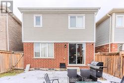 Walk out from kitchen to BBQ area -