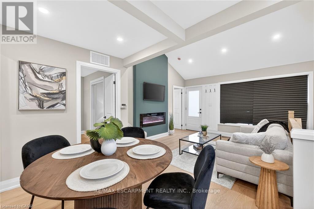 156 Walter Avenue N, Hamilton, ON - Indoor Photo Showing Dining Room With Fireplace