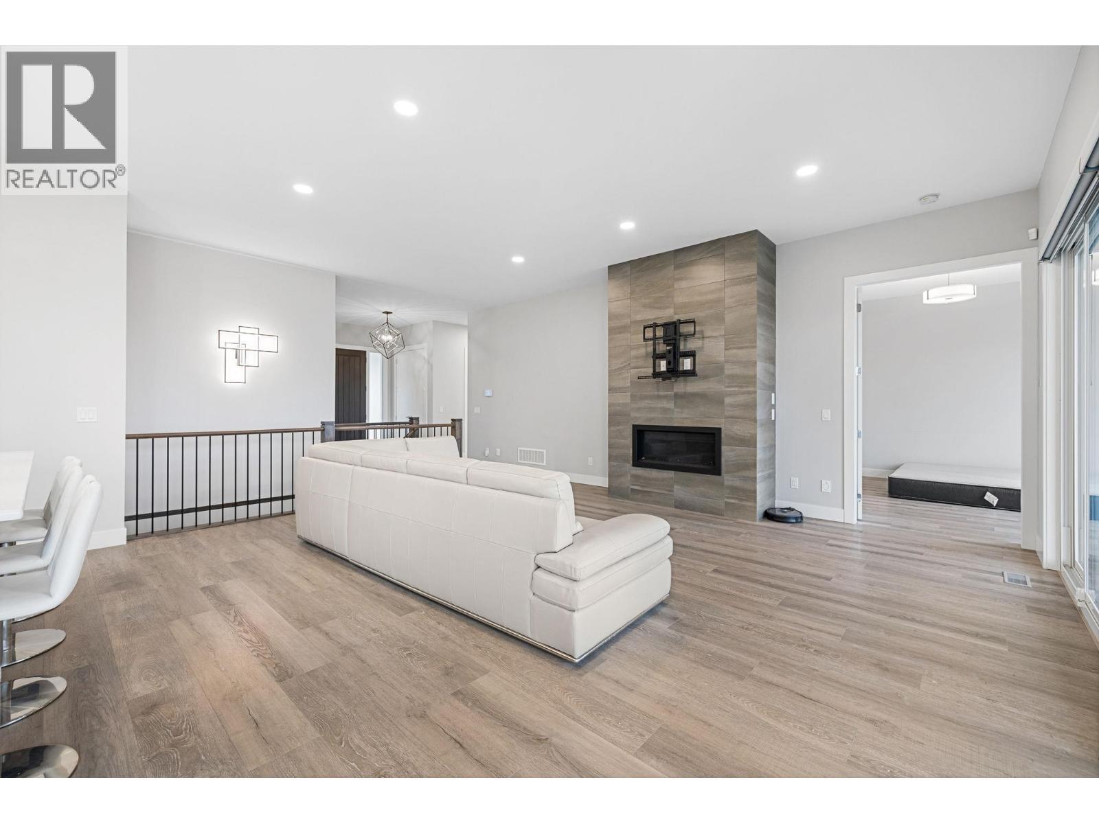 1940 Foxtail Terrace, Kelowna, BC - Indoor With Fireplace