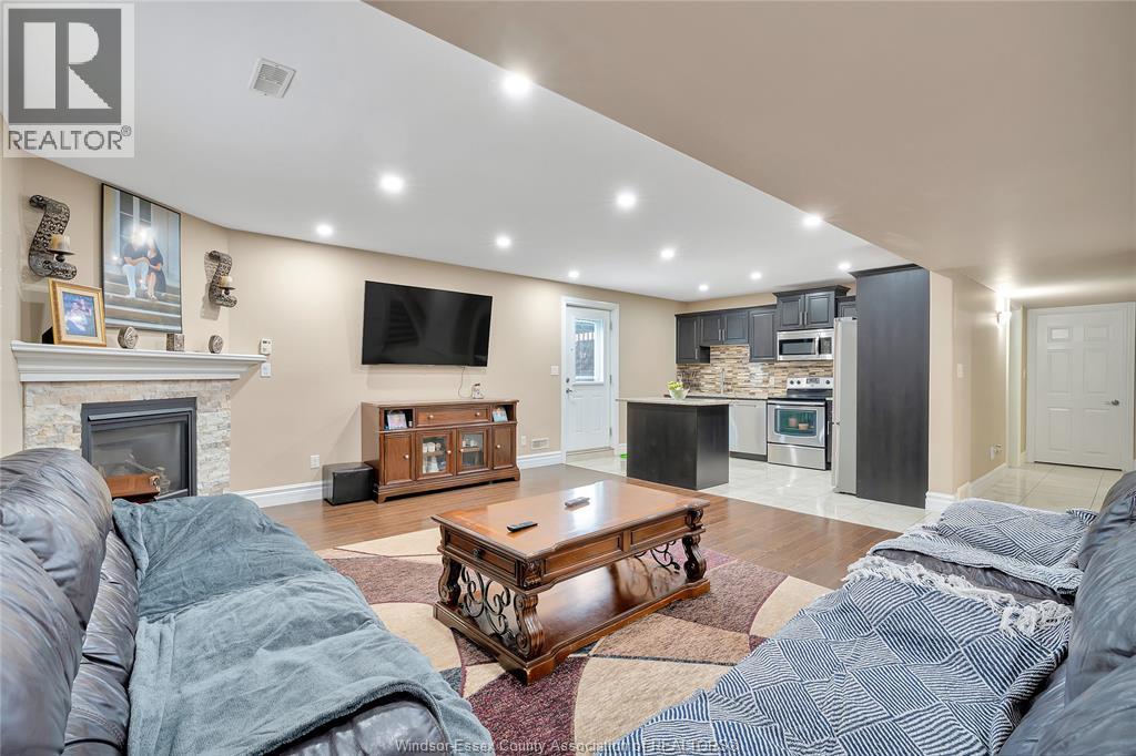 2988 Ruth Road, Windsor, ON - Indoor Photo Showing Living Room With Fireplace